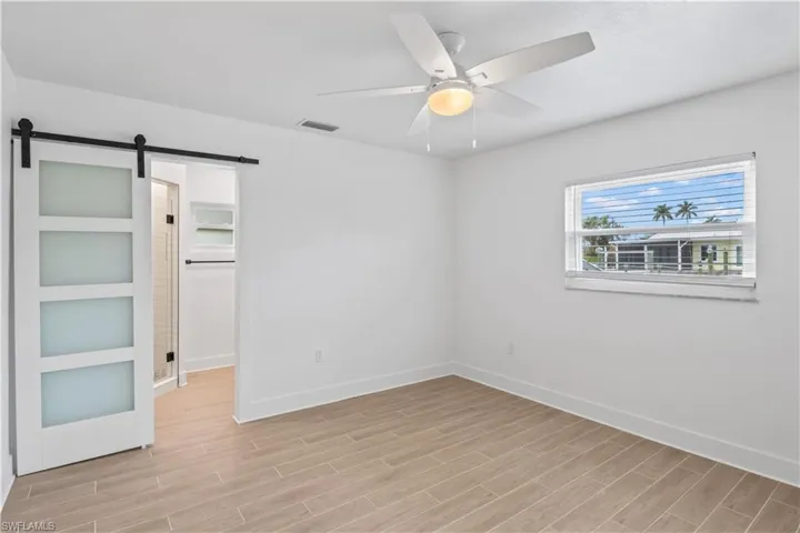Spacious bedroom designed for rest, relaxation and coastal living.