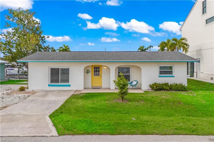 Beautifully maintained exterior offering an immediate impression of comfort and island charm.
