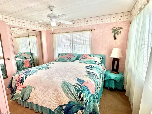 Master bedroom featuring ceiling fan