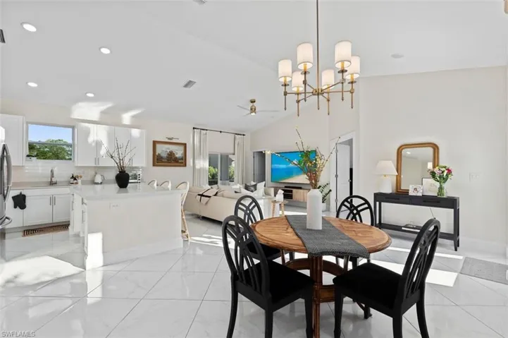 Dining space featuring a wealth of natural light, visible vents, baseboards, and recessed lighting