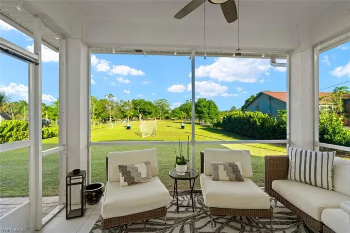 Sunroom / solarium featuring ceiling fan