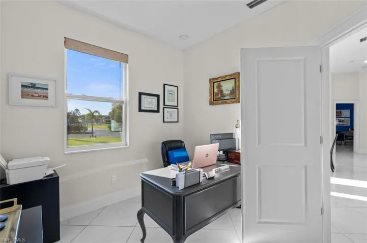 Office area with visible vents and baseboards
