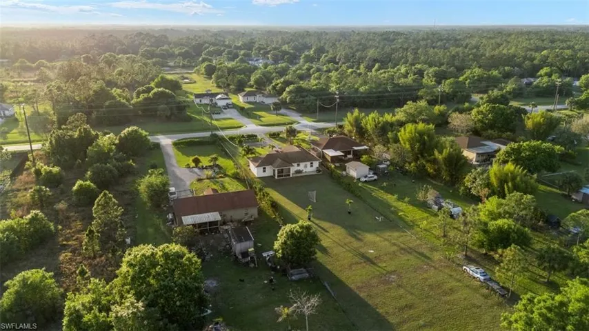 Aerial view featuring a view of trees