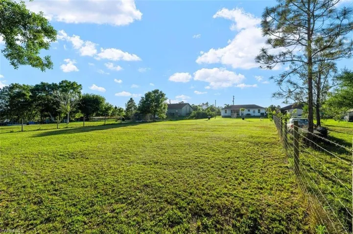 View of yard featuring fence