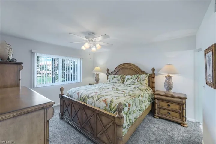 Bedroom featuring carpet and ceiling fan