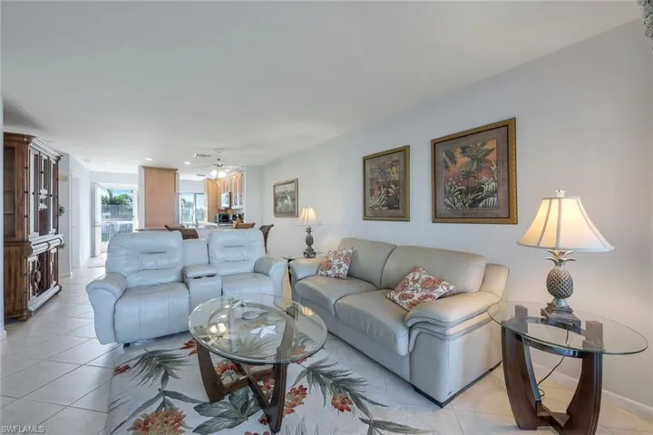 Living room with light tile patterned flooring
