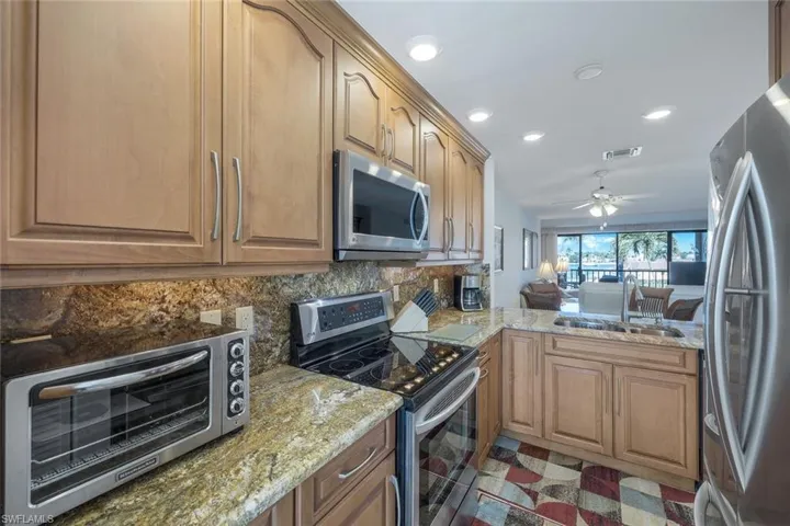 Kitchen featuring backsplash, double stainless steel sink