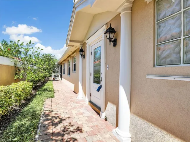 Entrance to property featuring stucco siding