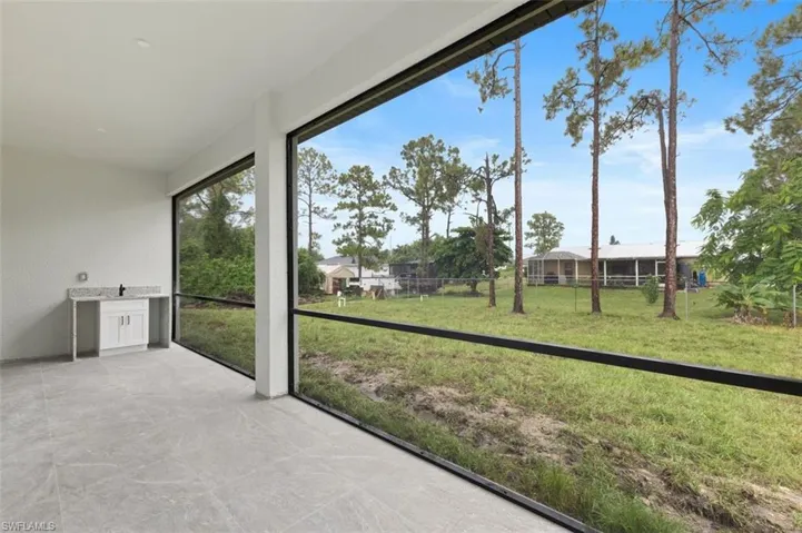 Unfurnished sunroom featuring plenty of natural light