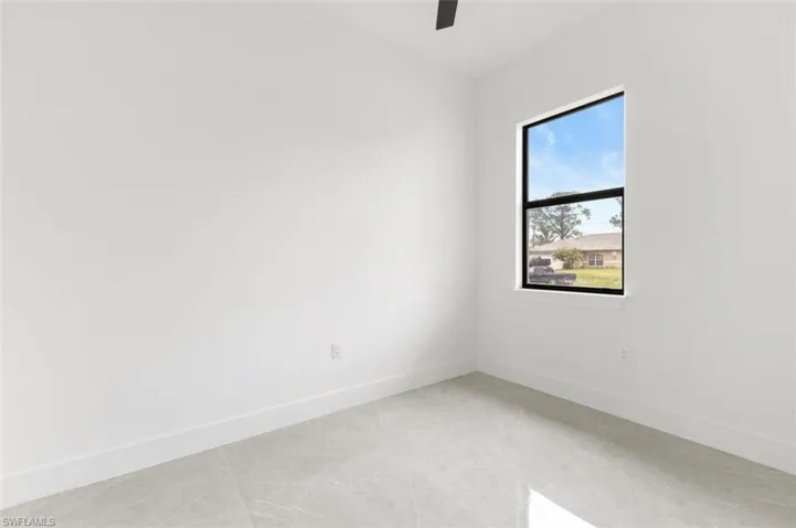 Unfurnished room featuring light tile patterned floors