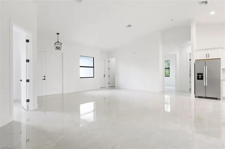 Empty room featuring light tile patterned floors
