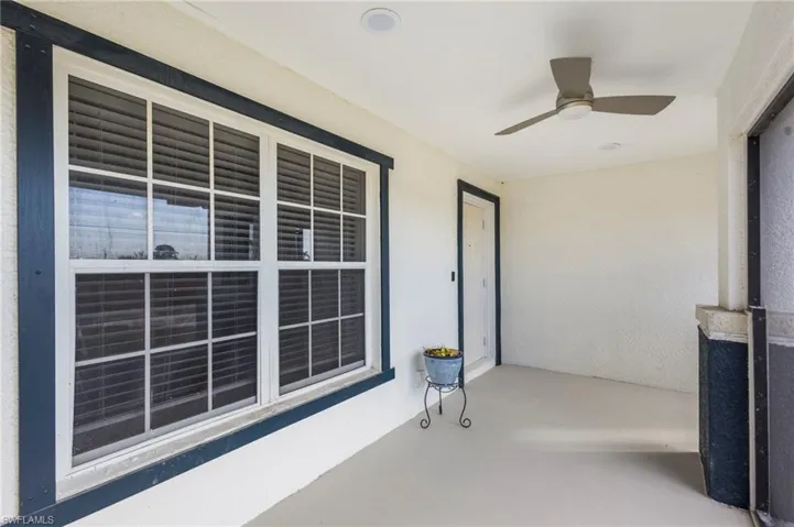 View of patio / terrace with ceiling fan and a porch