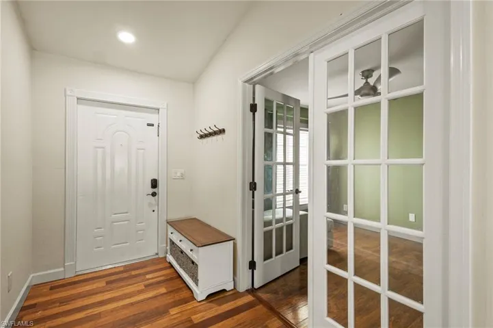 Entryway with dark hardwood / wood-style floors