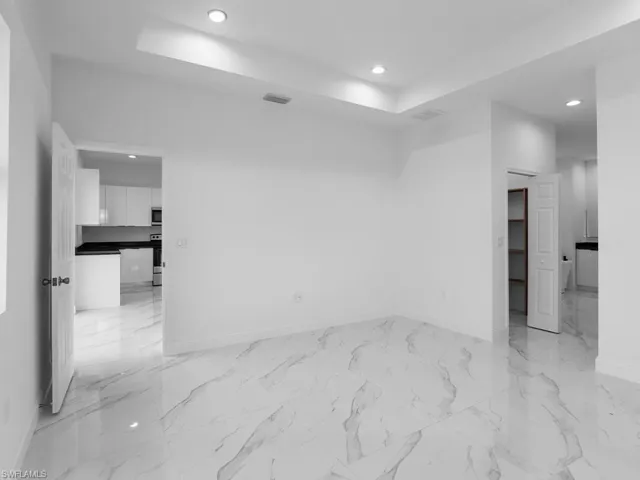 Empty room featuring light tile patterned floors