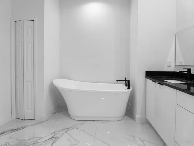 Bathroom with vanity and tile patterned flooring