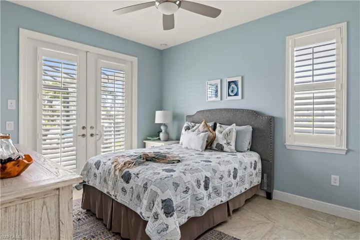 2nd Bedroom with French doors and ceiling fan