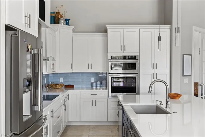 Beautiful backsplash, Induction stove & deep Granite Sink