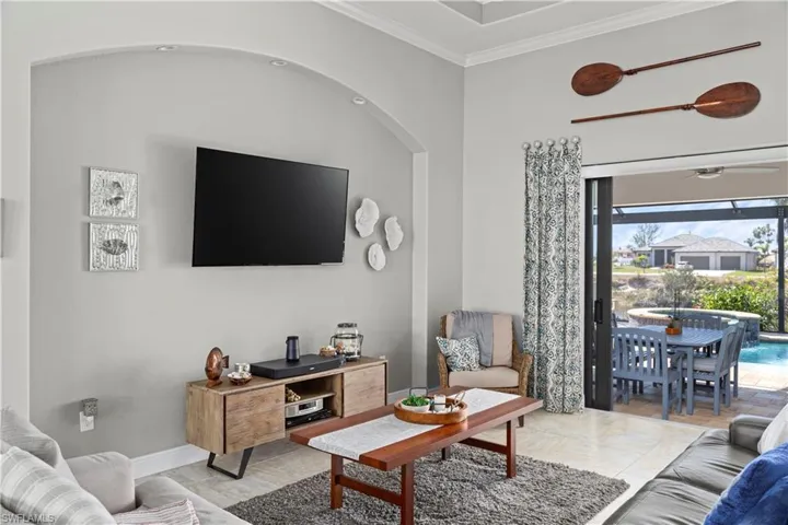 Tiled living room featuring 90 degree pocket sliders! AMAZING for entertaining!