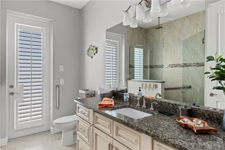 Full Hall Bath with door to outside pool deck