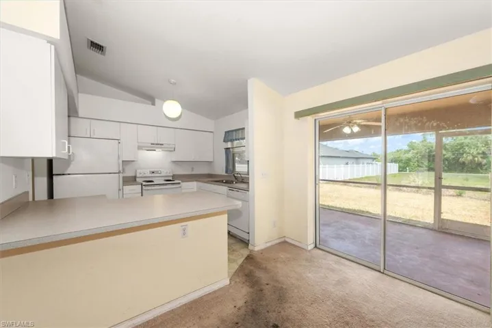 Kitchen bar and rear lanai view