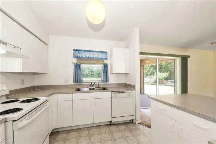 kitchen view with a nice window to view the backyard.