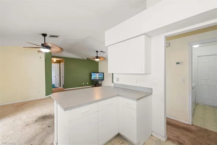 Kitchen view with the laundry room just off to the right in the picture