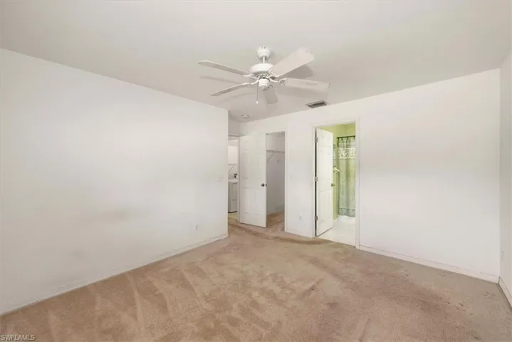 Primary bedroom view features a walk in closet