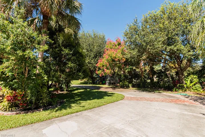 View of community featuring a lawn