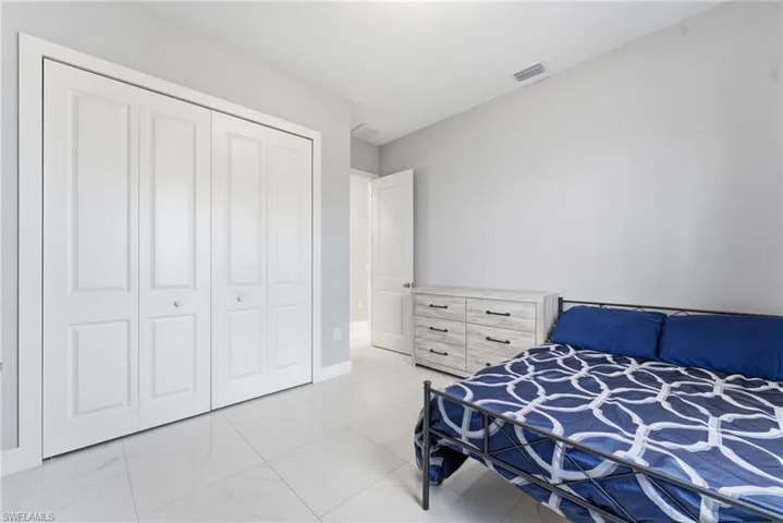 Bedroom featuring a closet and baseboards