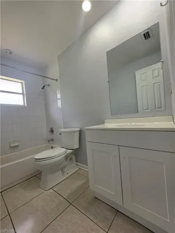 Tile flooring with matching wall tile in the bath area