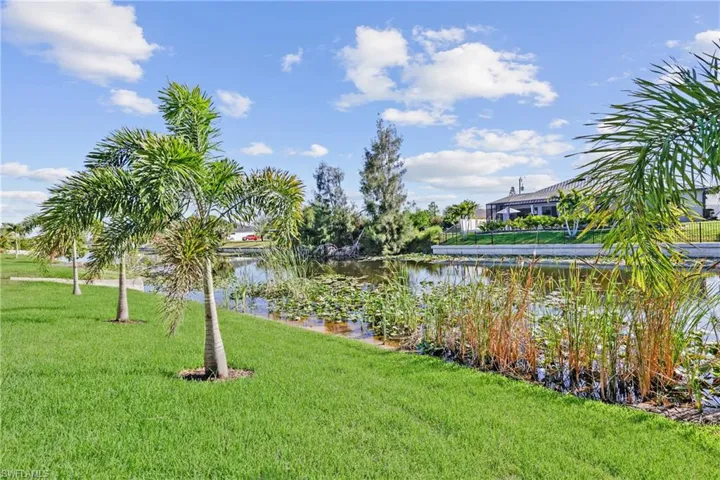 View of grassy yard featuring a water view