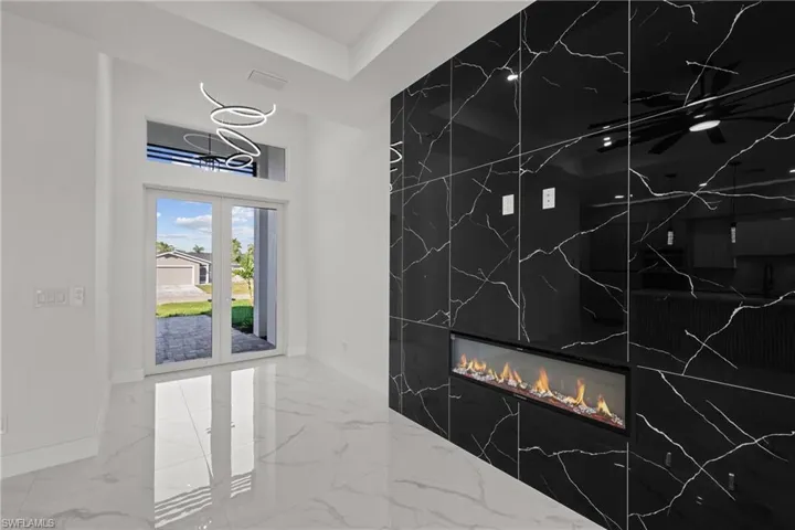 Detailed view of baseboards and a fireplace