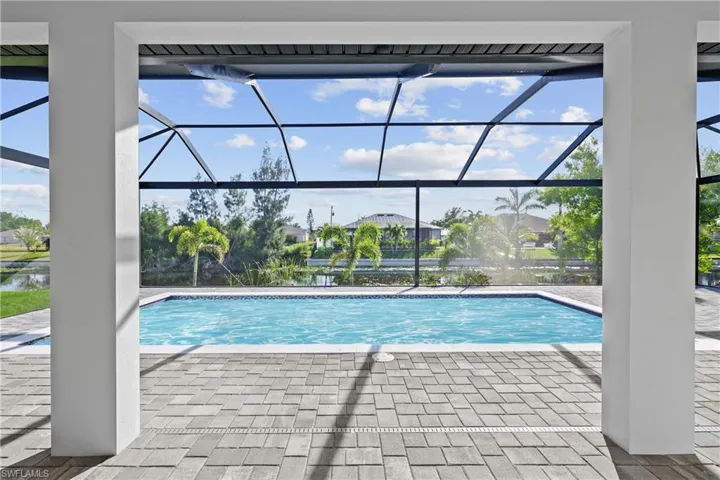 Outdoor pool featuring a patio area and a lanai