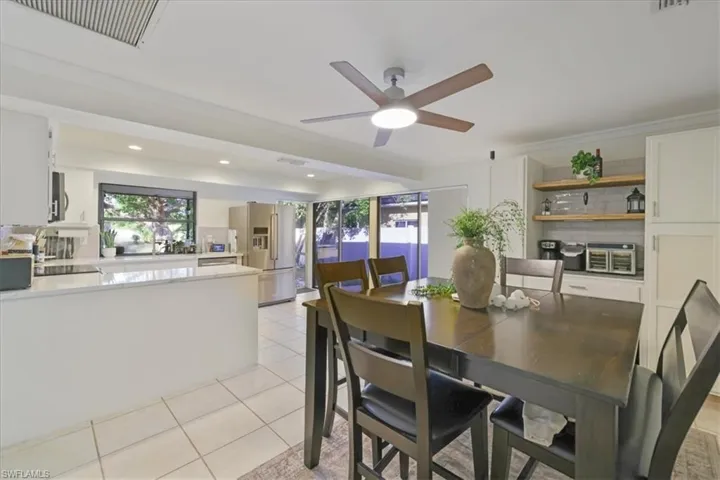 Informal Dining area featuring a ceiling fan, built-in additional kitchen storage/pantry