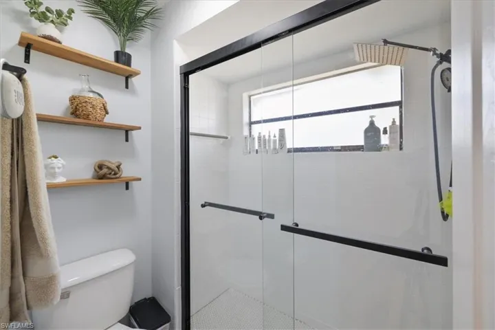 Primary Bathroom featuring a walk-in shower