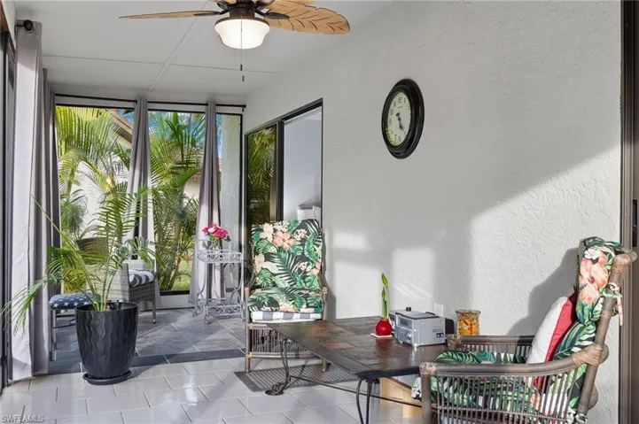 Sunroom featuring ceiling fan
