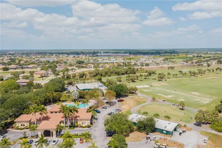Birds eye view of property with golf course view