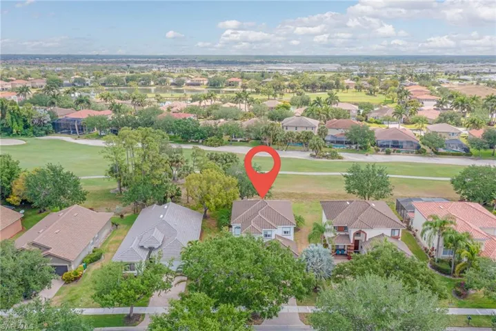 Aerial view featuring a residential view and view of golf course