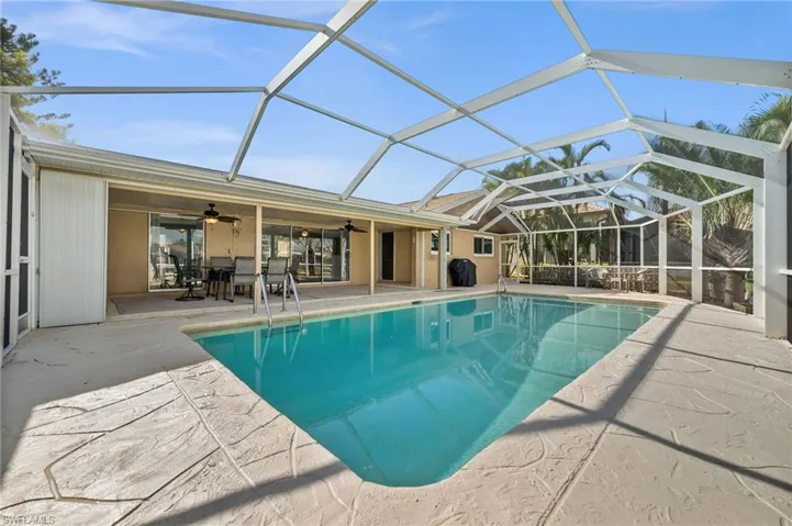 Pool area with large lanai and lounge area.