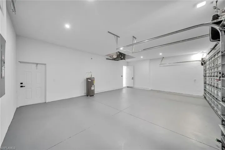 Garage with recessed lighting and electric water heater