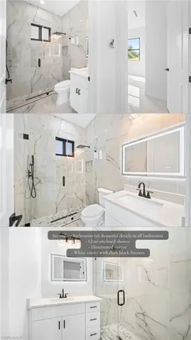 Glass-enclosed shower with black hardware, white vanity with stone-finish countertop, illuminated mirror, and large format wall and floor tiling