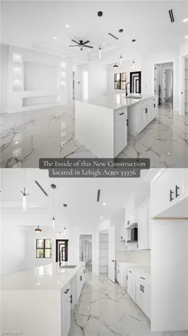 Spacious kitchen with a large island, white cabinetry, integrated sink, and white countertops