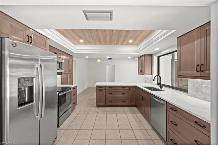 Remolded Kitchen - Wood Cabinets, Quartz Countertops & Stainless Steel Appliances