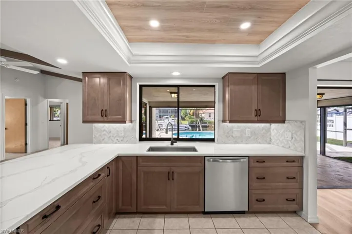 Remolded Kitchen - Wood Cabinets, Quartz Countertops & Stainless Steel Appliances