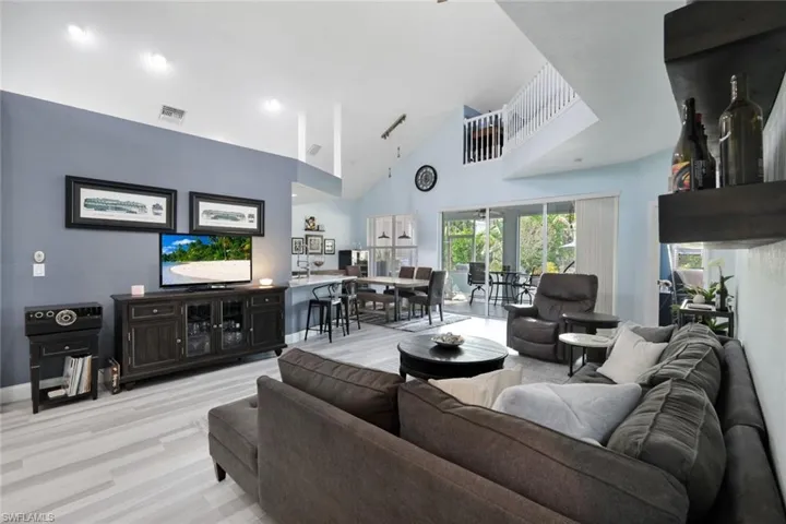 You will love to entertain in this open and airy living room. VAULTED CEILINGS THROUGHOUT THE HOME!
