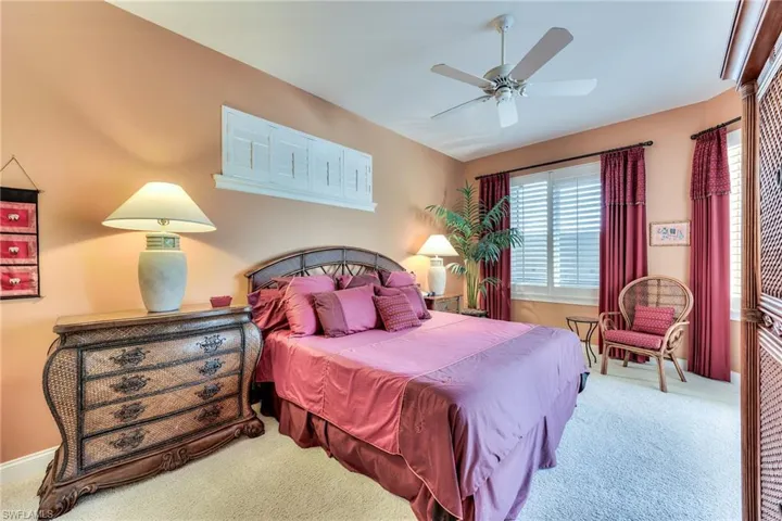 Bedroom featuring ceiling fan and carpet flooring