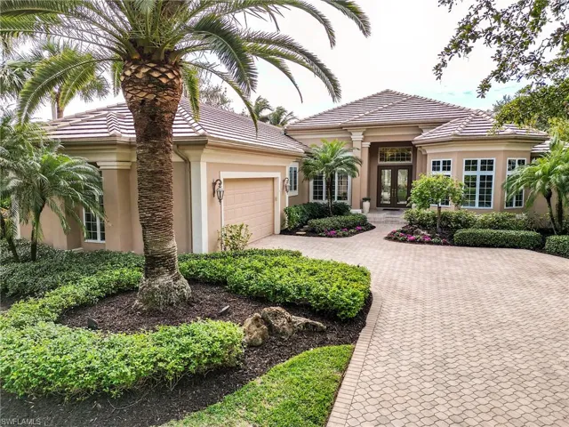 View of front of house featuring french doors and a garage
