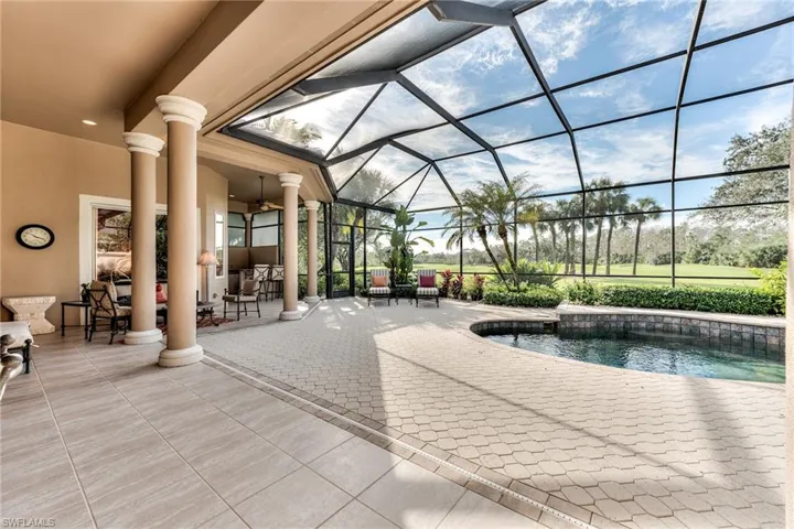 View of swimming pool featuring a lanai, a patio, and ceiling fan