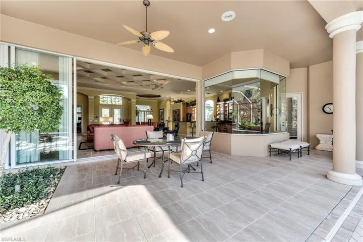View of patio featuring ceiling fan