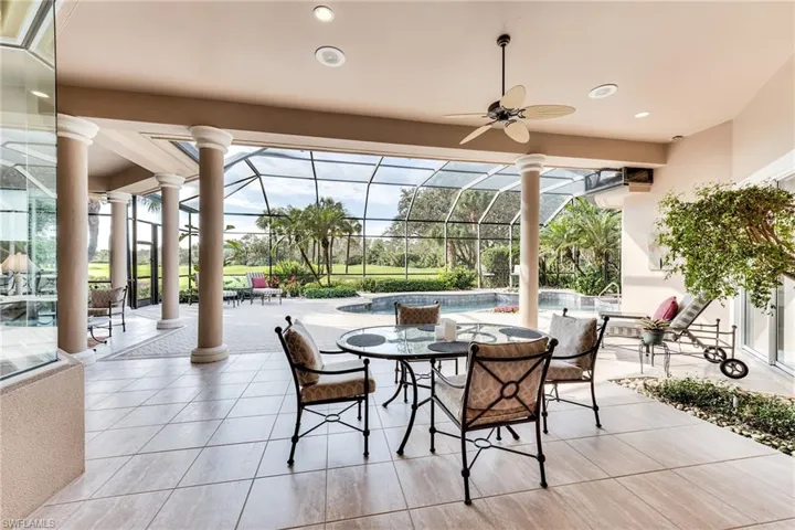 Sunroom featuring ceiling fan